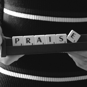 Blocks spelling out praise. Meant to illustrate psalms of praise.