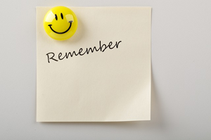 Image of a smiley face with reminder post it. Meant to illustrate how we need to always think about important Godly things daily